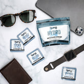 Hung Hydro Water-Based Snap + Slide™ Multiple Packs and Bag laying on iPad